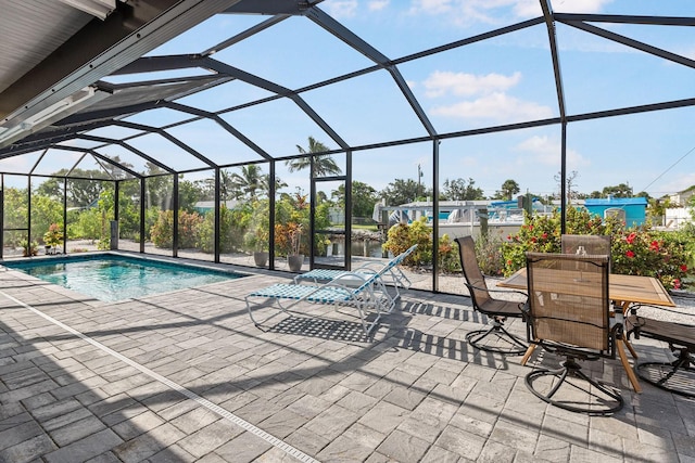 1030 Haste Ln, Englewood, FL 34223 - swimming pool with a patio area and glass enclosure