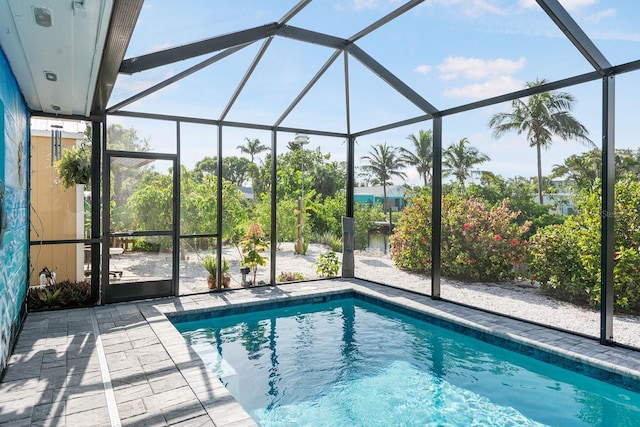 1030 Haste Ln, Englewood, FL 34223 - swimming pool with glass enclosure and a patio area