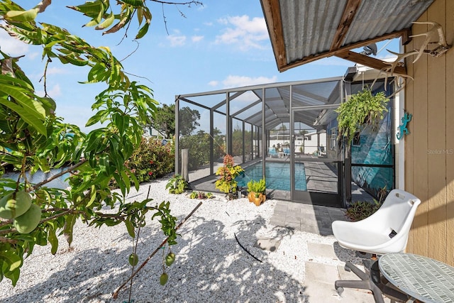 1030 Haste Ln, Englewood, FL 34223 - outdoor pool featuring a patio area and glass enclosure