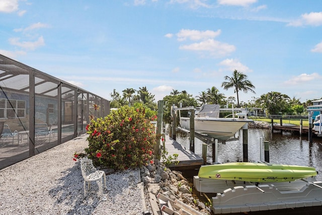 1030 Haste Ln, Englewood, FL 34223 - dock with boat lift, a water view, and a lanai