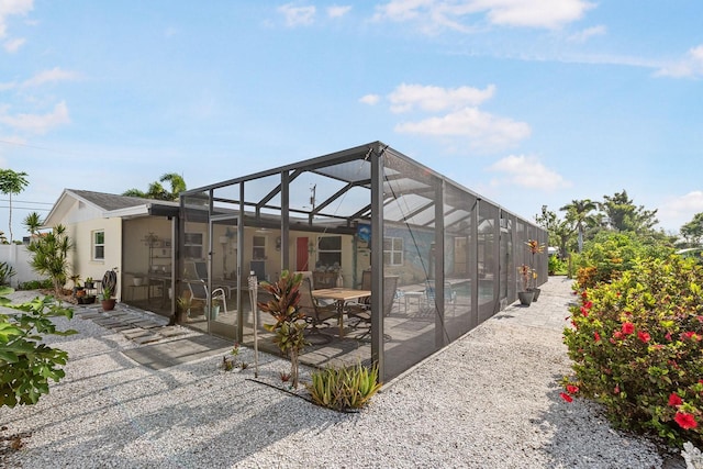 1030 Haste Ln, Englewood, FL 34223 - back of house featuring a patio, an outdoor pool, and a lanai
