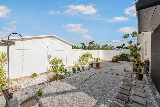 1030 Haste Ln, Englewood, FL 34223 - fenced backyard featuring a patio