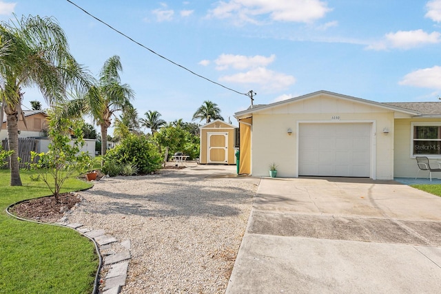 1030 Haste Ln, Englewood, FL 34223 - view of property exterior featuring a storage unit, concrete driveway, and an attached garage