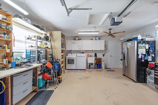 1030 Haste Ln, Englewood, FL 34223 - garage featuring separate washer and dryer, stainless steel refrigerator with ice dispenser, a workshop area, a garage door opener, and ceiling fan