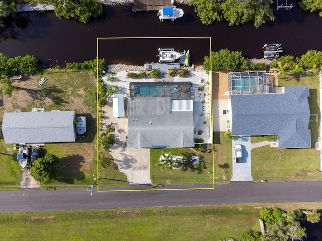 1030 Haste Ln, Englewood, FL 34223 - aerial view of property and surrounding area featuring property boundaries highlighted and a large body of water