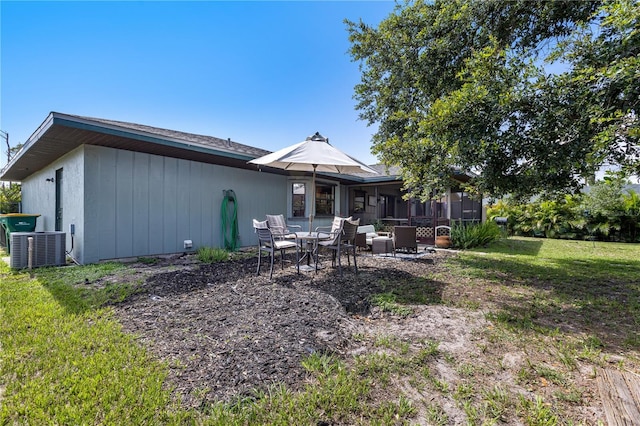 7104 Castilla St, Port Charlotte, FL 33981 - rear view of house with a yard and a patio area