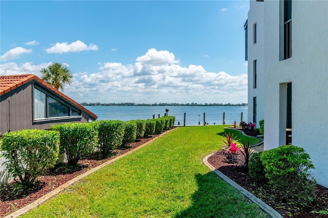2955 N Beach Rd Unit A411, Englewood, FL 34223 - view of green lawn featuring a water view