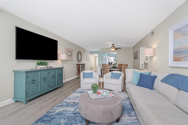 2955 N Beach Rd Unit A411, Englewood, FL 34223 - living room with light wood finished floors and ceiling fan