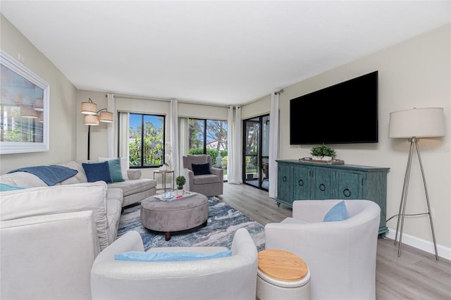 2955 N Beach Rd Unit A411, Englewood, FL 34223 - living area featuring wood finished floors and baseboards