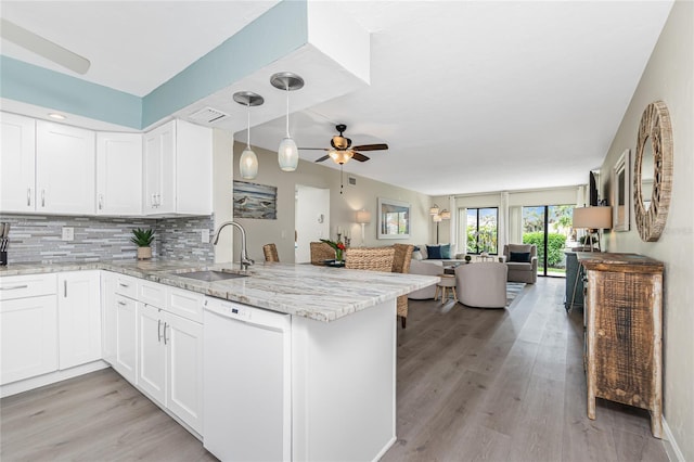 2955 N Beach Rd Unit A411, Englewood, FL 34223 - kitchen featuring dishwasher, ceiling fan, open floor plan, a peninsula, and light stone counters