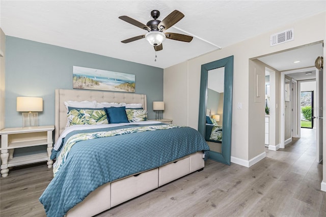 2955 N Beach Rd Unit A411, Englewood, FL 34223 - bedroom featuring wood finished floors and a ceiling fan