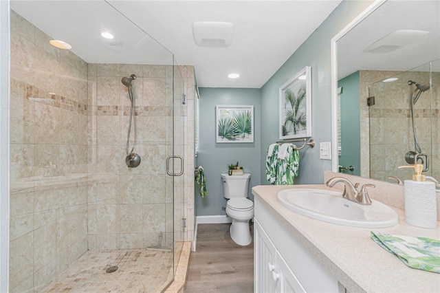 2955 N Beach Rd Unit A411, Englewood, FL 34223 - full bath with a shower stall, vanity, wood finished floors, and recessed lighting