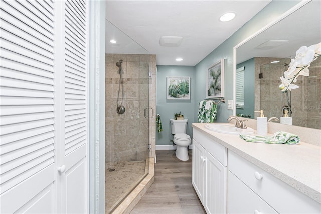 2955 N Beach Rd Unit A411, Englewood, FL 34223 - full bath with a shower stall, vanity, wood finished floors, and recessed lighting