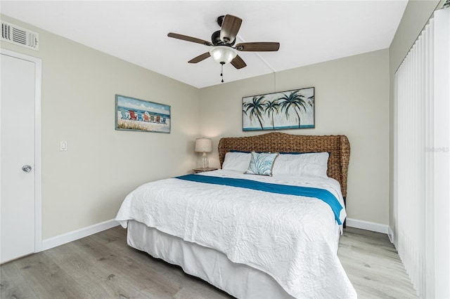 2955 N Beach Rd Unit A411, Englewood, FL 34223 - bedroom featuring wood finished floors and a ceiling fan