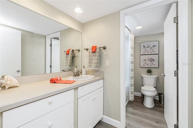 2955 N Beach Rd Unit A411, Englewood, FL 34223 - bathroom featuring wood finished floors, vanity, and a shower with shower curtain
