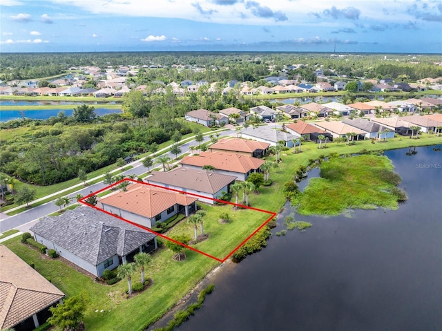1530 Hyssop Loop, North Port, FL 34289 - aerial perspective of suburban area with property parcel outlined and a large body of water