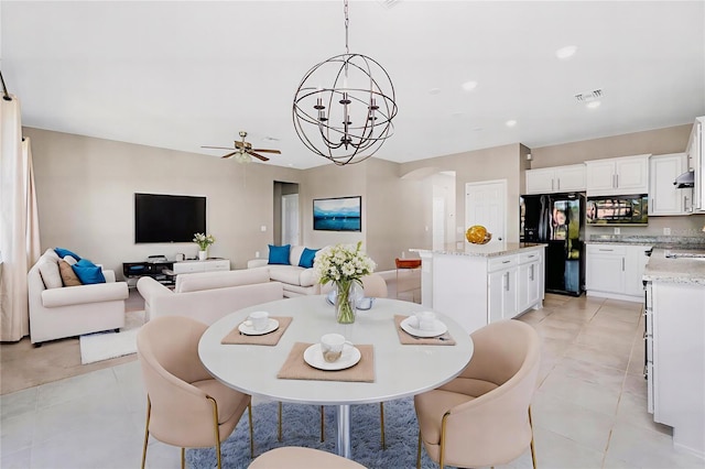 1530 Hyssop Loop, North Port, FL 34289 - dining area featuring recessed lighting, a chandelier, arched walkways, a ceiling fan, and light tile patterned floors