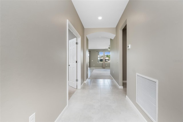 1530 Hyssop Loop, North Port, FL 34289 - corridor featuring arched walkways and light tile patterned flooring
