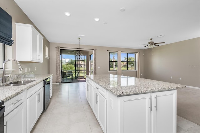 1530 Hyssop Loop, North Port, FL 34289 - kitchen featuring a center island, plenty of natural light, ceiling fan, black dishwasher, and recessed lighting
