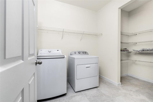1530 Hyssop Loop, North Port, FL 34289 - laundry area with independent washer and dryer and light tile patterned flooring