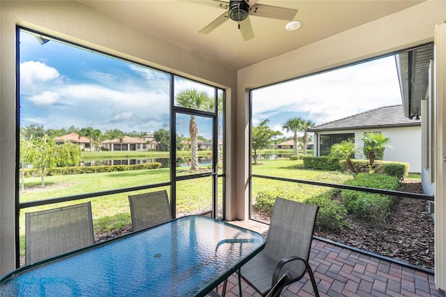 1530 Hyssop Loop, North Port, FL 34289 - sunroom featuring a ceiling fan, a water view, and outdoor dining space