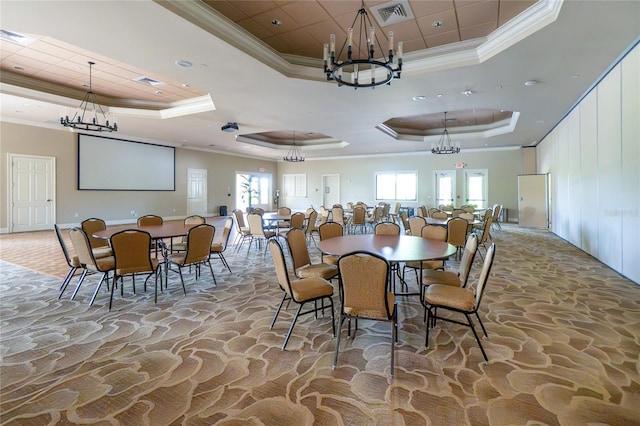 1530 Hyssop Loop, North Port, FL 34289 - dining space with a raised ceiling, a chandelier, ornamental molding, and stone floors