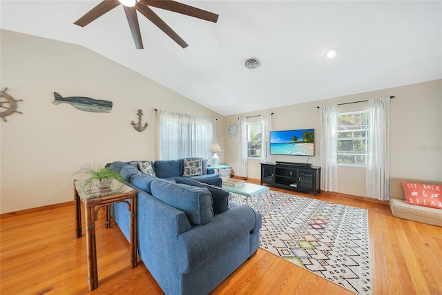 7453 Spinnaker Blvd, Englewood, FL 34224 - living area featuring vaulted ceiling, a ceiling fan, and wood finished floors