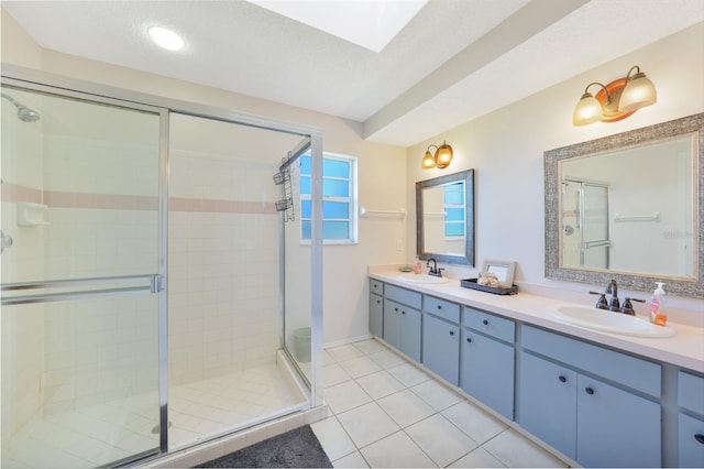7453 Spinnaker Blvd, Englewood, FL 34224 - bathroom featuring a shower stall, double vanity, tile patterned floors, and a skylight