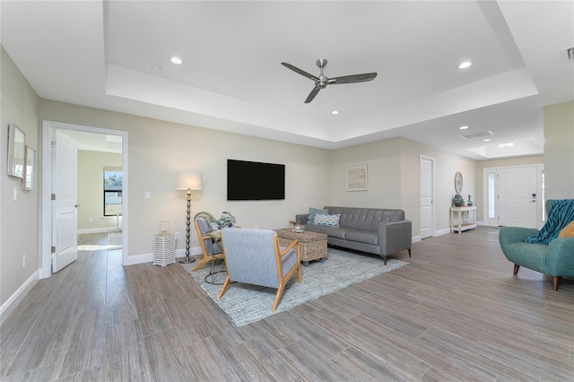 184 Spring Dr, Rotonda West, FL 33947 - living area featuring a raised ceiling, ceiling fan, wood finished floors, and recessed lighting