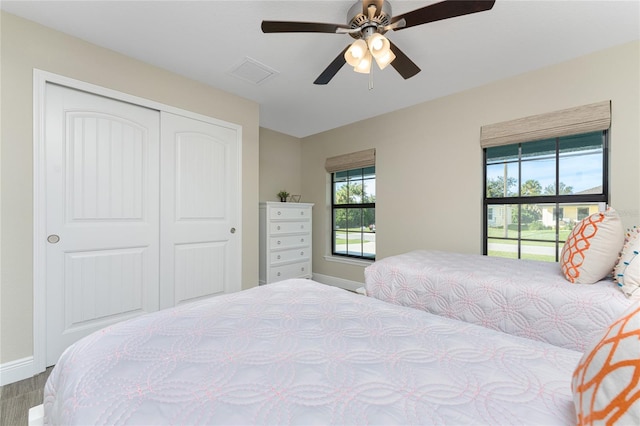 184 Spring Dr, Rotonda West, FL 33947 - bedroom with a closet and a ceiling fan