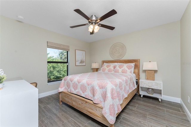 184 Spring Dr, Rotonda West, FL 33947 - bedroom featuring wood tiled floors and a ceiling fan