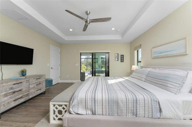 184 Spring Dr, Rotonda West, FL 33947 - bedroom with wood finished floors, access to exterior, recessed lighting, a raised ceiling, and ceiling fan