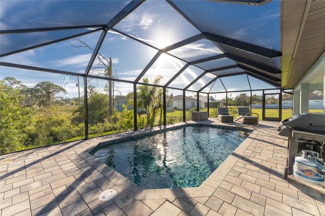 184 Spring Dr, Rotonda West, FL 33947 - outdoor pool with a patio area, a lanai, and area for grilling