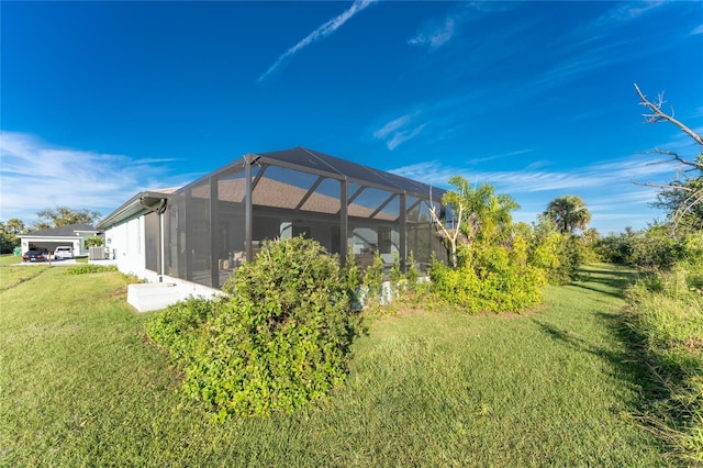 184 Spring Dr, Rotonda West, FL 33947 - view of grassy yard featuring a lanai