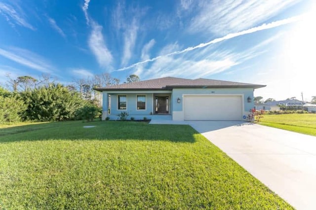 184 Spring Dr, Rotonda West, FL 33947 - single story home featuring an attached garage, a front yard, concrete driveway, and stucco siding