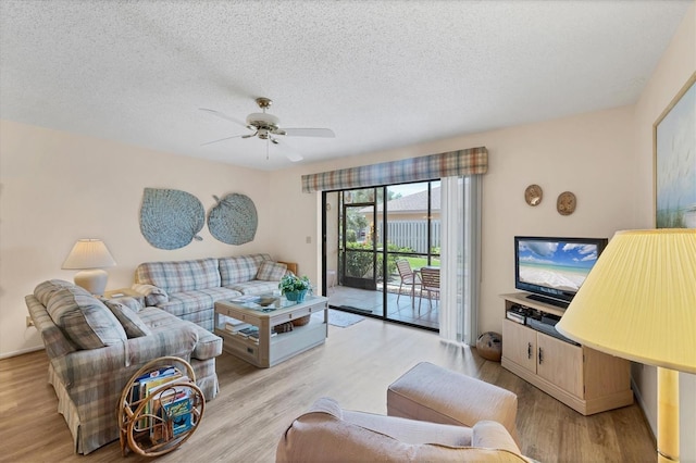 2004 Longpointe Cir Unit E2, Venice, FL 34293 - living room with ceiling fan, light wood-style flooring, and a textured ceiling