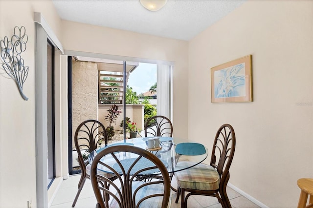 2004 Longpointe Cir Unit E2, Venice, FL 34293 - dining room featuring light tile patterned floors and a textured ceiling