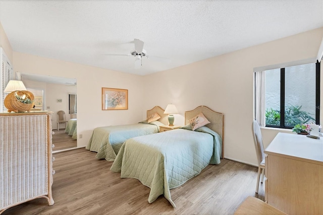 2004 Longpointe Cir Unit E2, Venice, FL 34293 - bedroom featuring light wood-style floors and ceiling fan