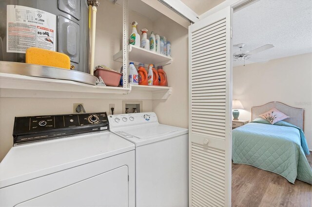 2004 Longpointe Cir Unit E2, Venice, FL 34293 - washroom featuring wood finished floors, separate washer and dryer, and ceiling fan