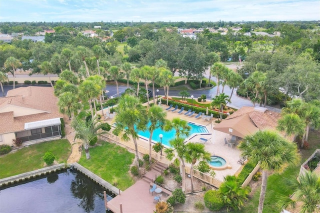 2004 Longpointe Cir Unit E2, Venice, FL 34293 - drone / aerial view of a pool and a tree filled landscape