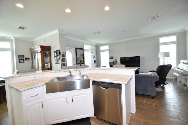 4354 Manatee Loop Unit 16A, Punta Gorda, FL 33950 - kitchen with dishwasher, open floor plan, ornamental molding, white cabinetry, and an island with sink