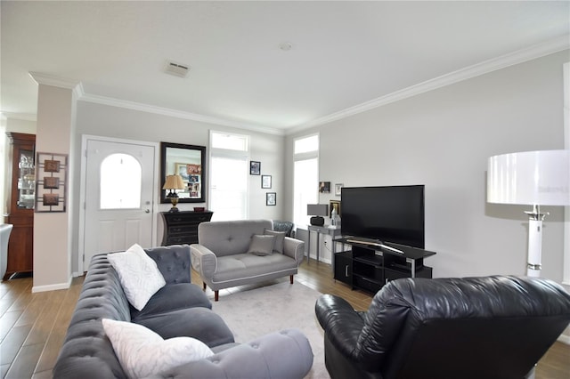 4354 Manatee Loop Unit 16A, Punta Gorda, FL 33950 - living area with ornamental molding, wood finished floors, and healthy amount of natural light