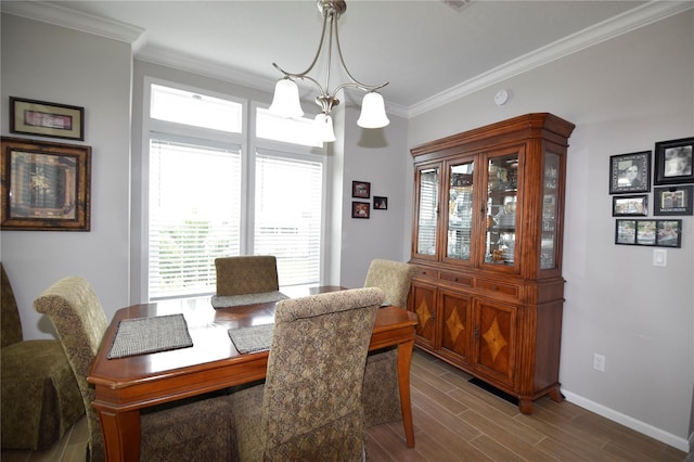 4354 Manatee Loop Unit 16A, Punta Gorda, FL 33950 - dining area with wood finished floors, crown molding, and a chandelier