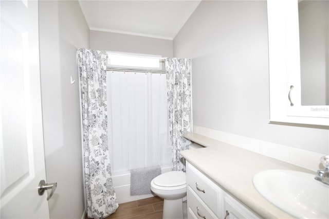 4354 Manatee Loop Unit 16A, Punta Gorda, FL 33950 - bathroom featuring vanity, shower / tub combo with curtain, wood finished floors, and ornamental molding