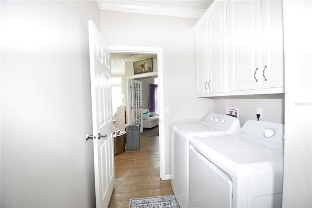 4354 Manatee Loop Unit 16A, Punta Gorda, FL 33950 - laundry area featuring cabinet space, independent washer and dryer, wood finish floors, french doors, and crown molding