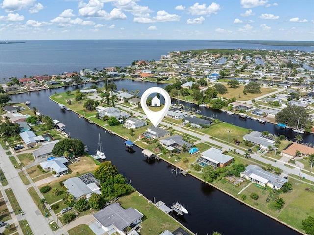 141 Baldwin Ct SE, Port Charlotte, FL 33952 - aerial view of property and surrounding area featuring a large body of water and nearby suburban area