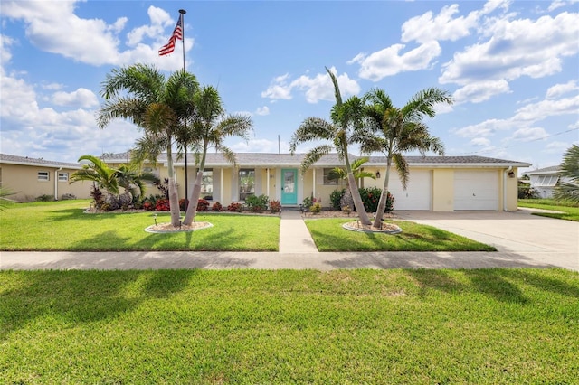 141 Baldwin Ct SE, Port Charlotte, FL 33952 - ranch-style house with driveway, a garage, a front yard, and stucco siding