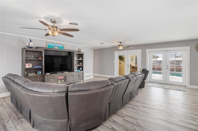 141 Baldwin Ct SE, Port Charlotte, FL 33952 - living room with french doors, ceiling fan, light wood finished floors, and ornamental molding