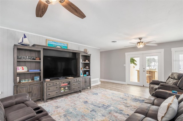 141 Baldwin Ct SE, Port Charlotte, FL 33952 - living area featuring a ceiling fan, french doors, and light wood-type flooring