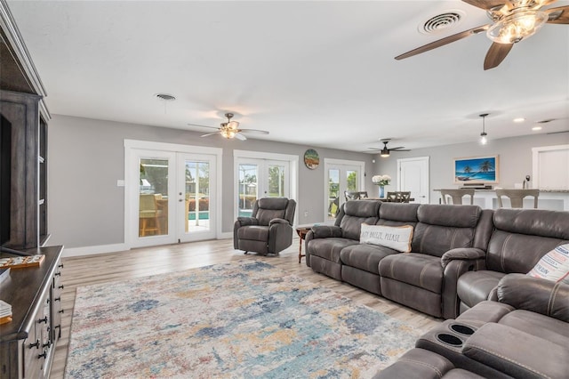 141 Baldwin Ct SE, Port Charlotte, FL 33952 - living room with ceiling fan, healthy amount of natural light, and french doors